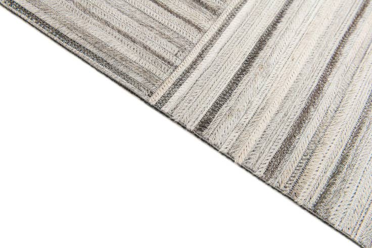 Detail image of 4' 11 x 8' 2 Cowhide Stocks Rug