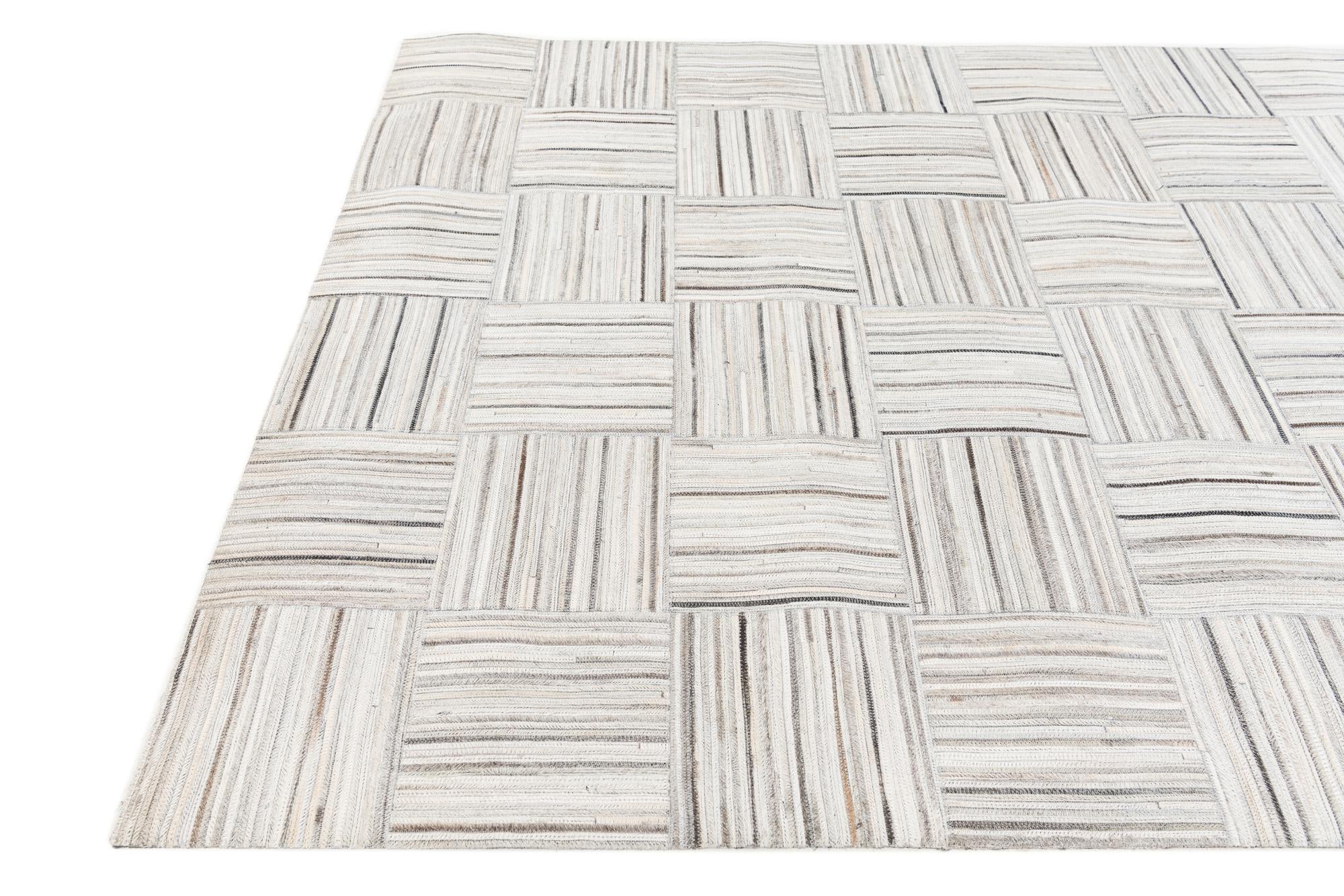 4' 11 x 8' 2 Cowhide Stocks Rug