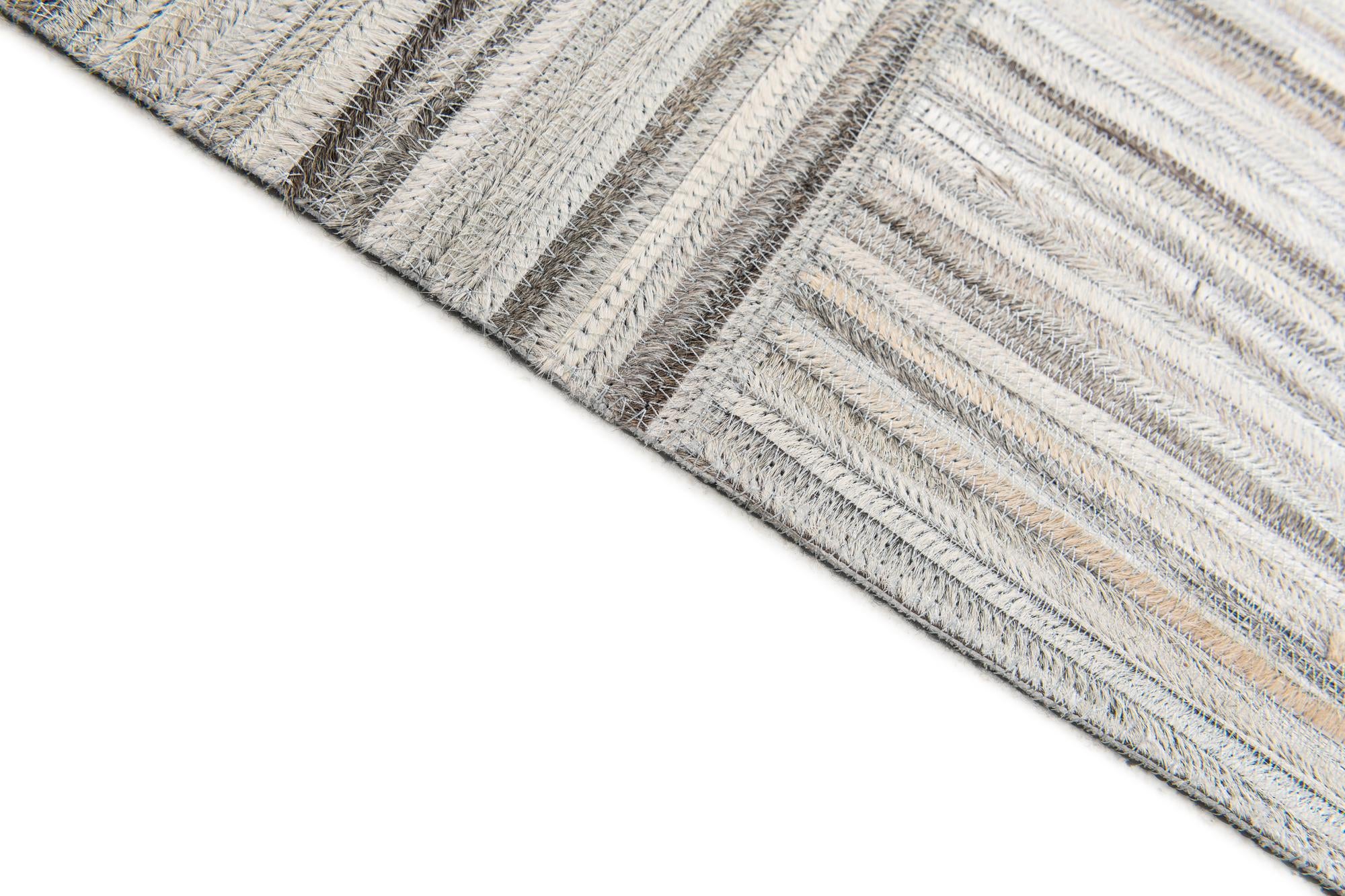 4' 11 x 8' 2 Cowhide Stocks Rug