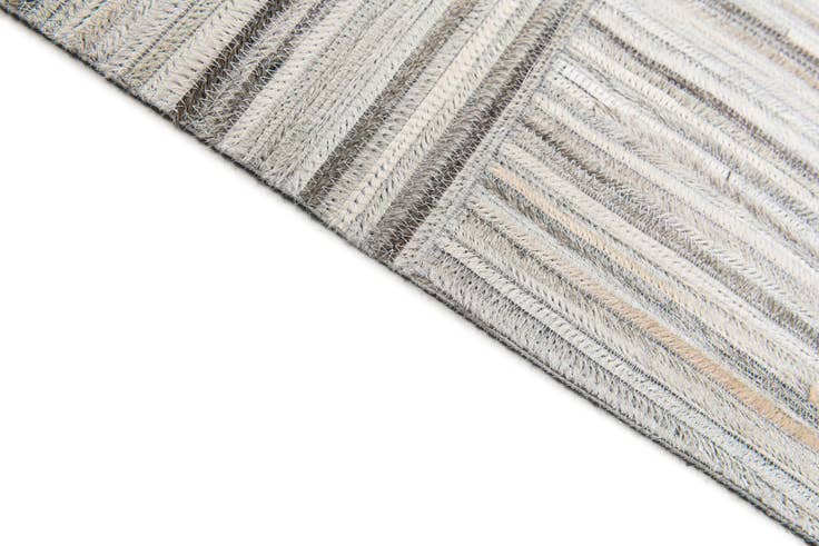 Detail image of 4' 11 x 8' 2 Cowhide Stocks Rug