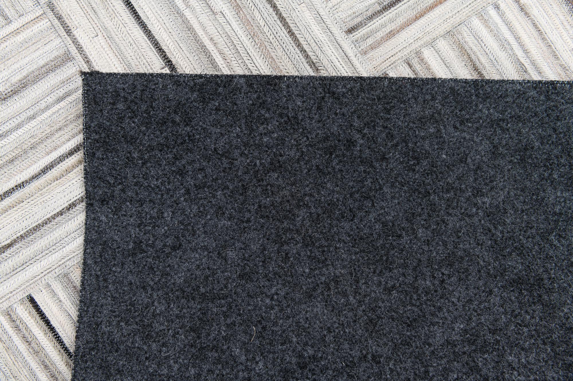 4' 11 x 8' 2 Cowhide Stocks Rug