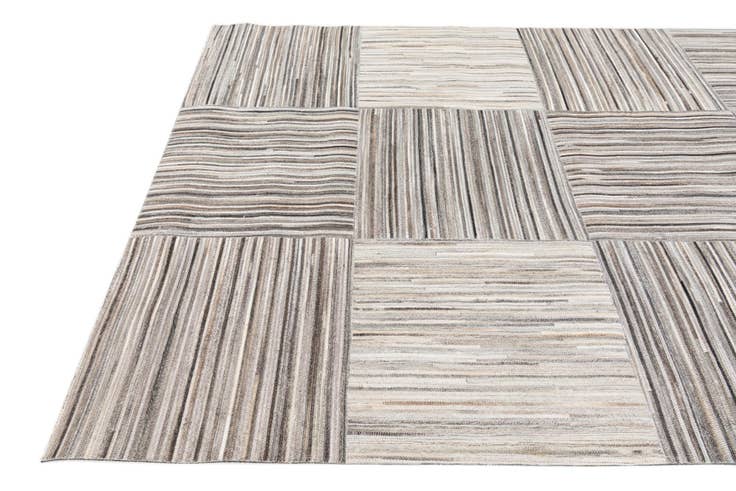 Detail image of 4' 11 x 8' 1 Cowhide Stocks Rug