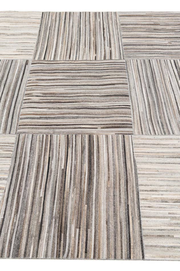 Detail image of 4' 11 x 8' 1 Cowhide Stocks Rug