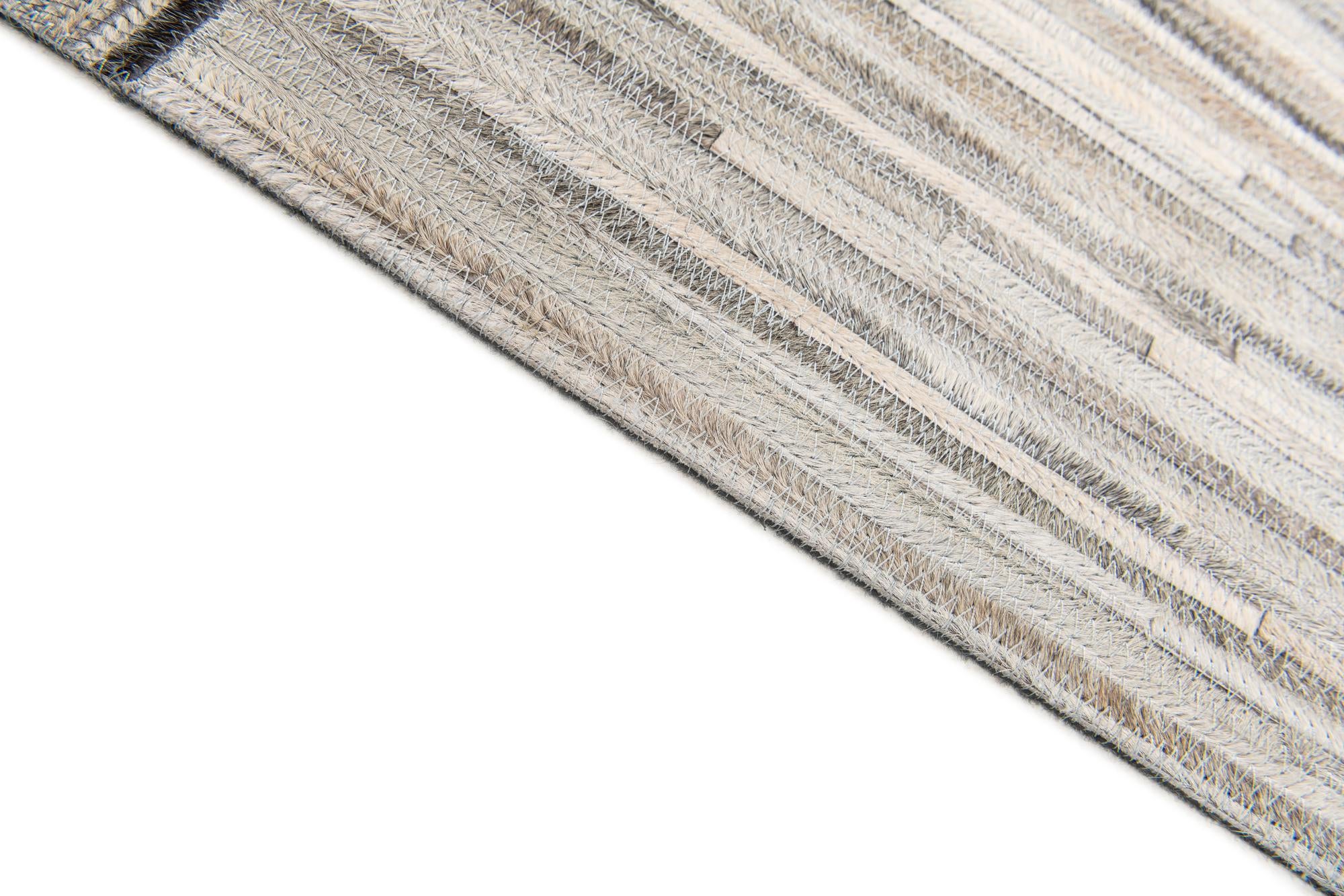 4' 11 x 8' 1 Cowhide Stocks Rug
