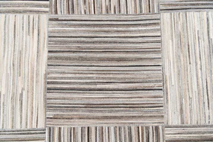 4' 11 x 8' 1 Cowhide Stocks Rug