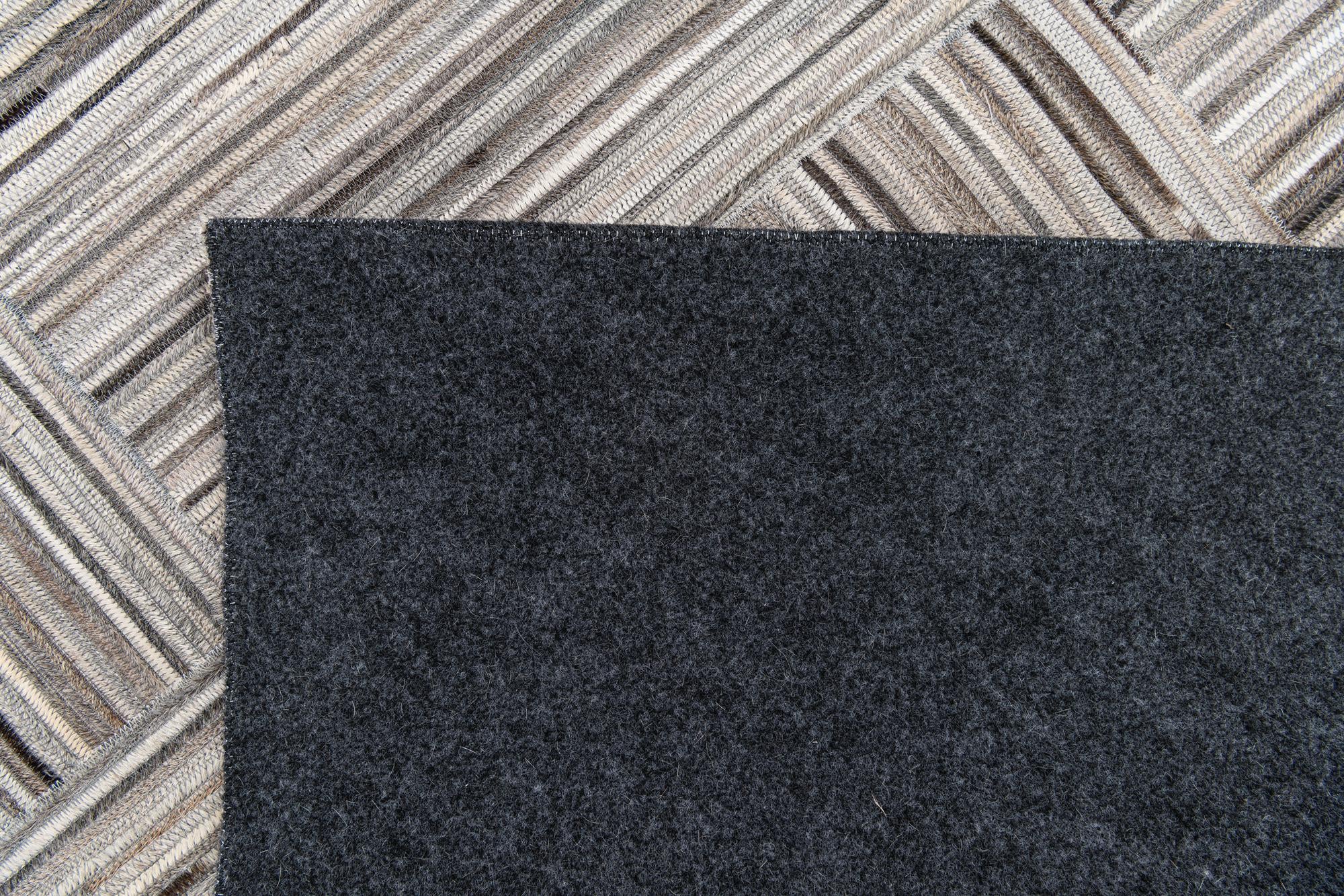 4' 11 x 8' 1 Cowhide Stocks Rug