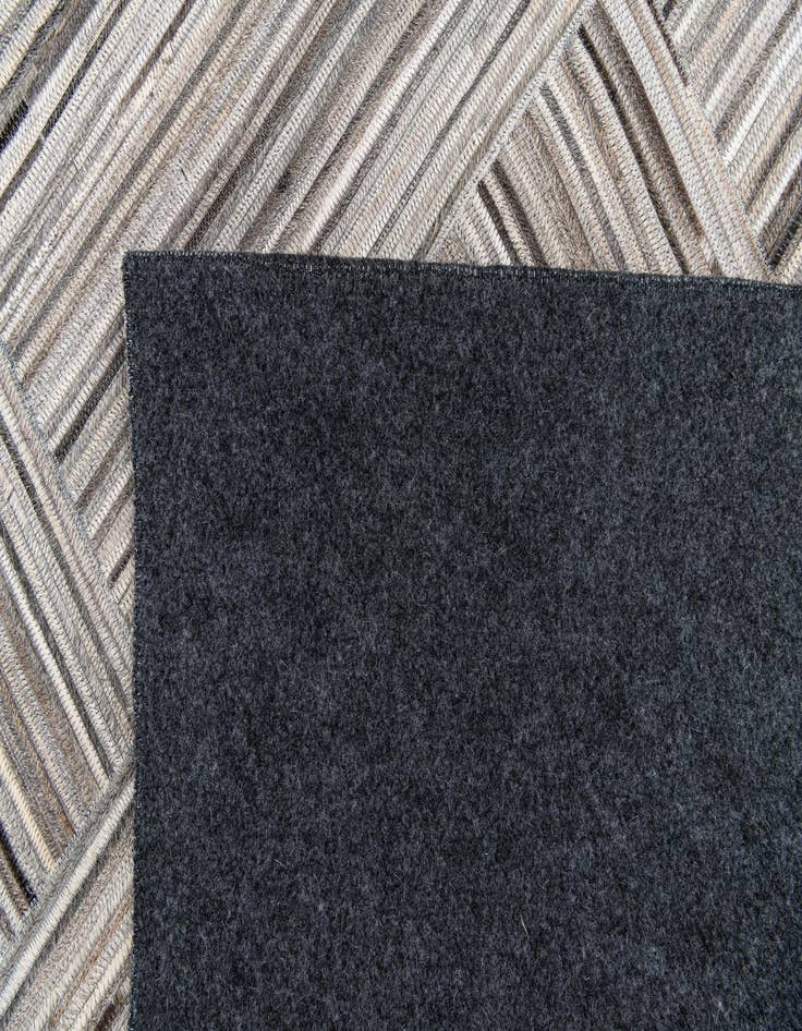 Detail image of 4' 11 x 8' 1 Cowhide Stocks Rug