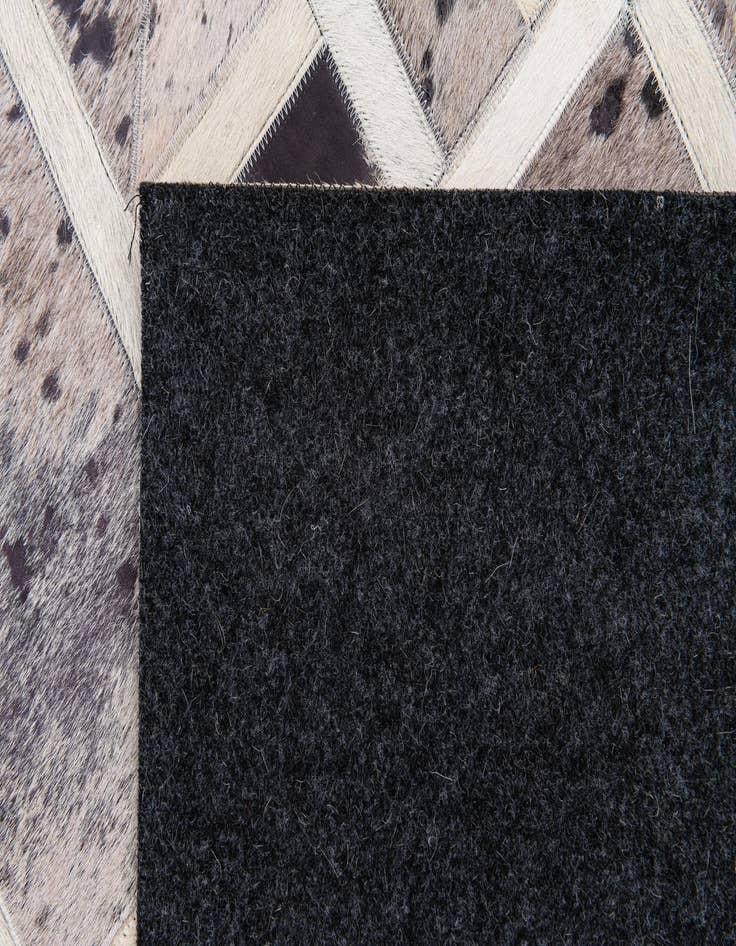 Detail image of 4' 11 x 8' Cowhide Stocks Rug