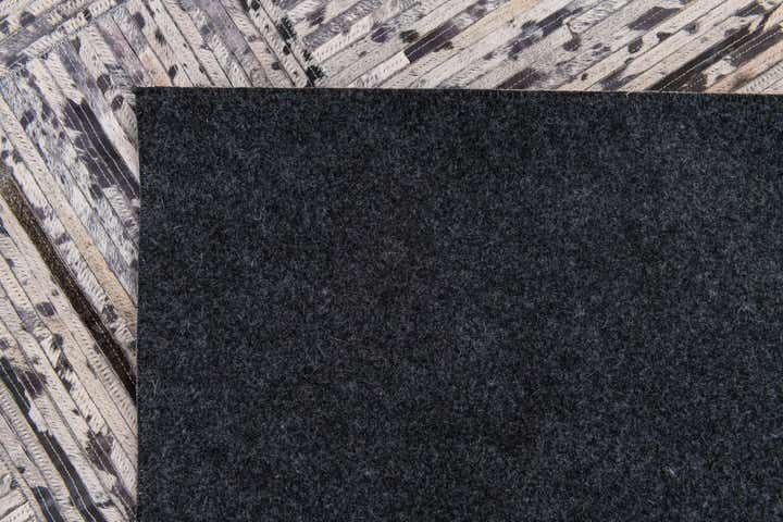 4' 11 x 7' 10 Cowhide Stocks Rug