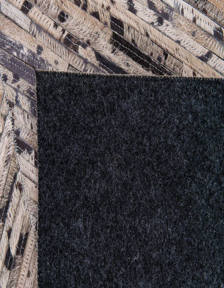 Detail image of 5' 1 x 8' 2 Cowhide Stocks Rug