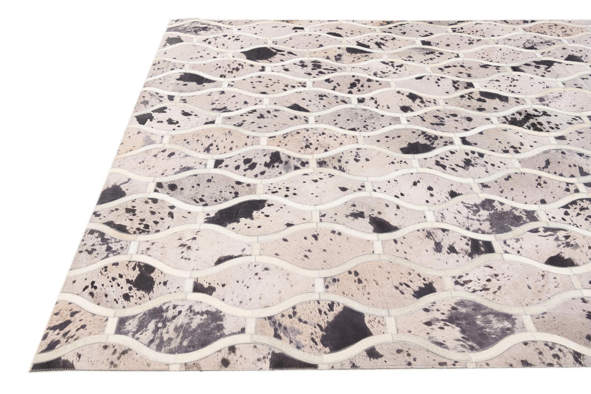 4' 11 x 7' 9 Cowhide Stocks Rug