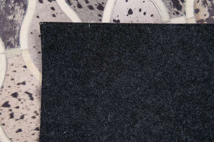 4' 11 x 7' 9 Cowhide Stocks Rug
