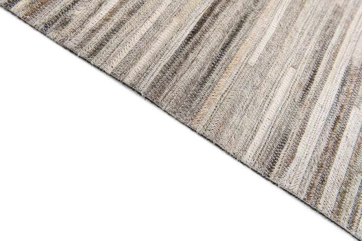 Detail image of 4' 11 x 8' 2 Cowhide Stocks Rug