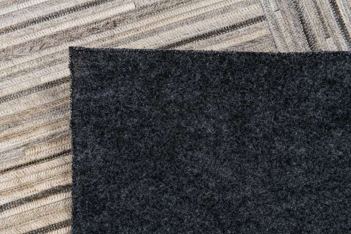 4' 11 x 8' 2 Cowhide Stocks Rug