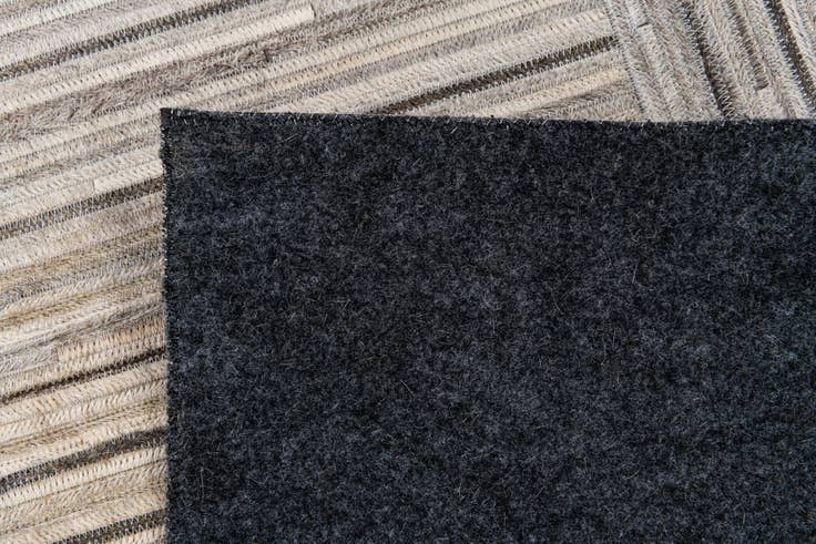 Detail image of 4' 11 x 8' 2 Cowhide Stocks Rug