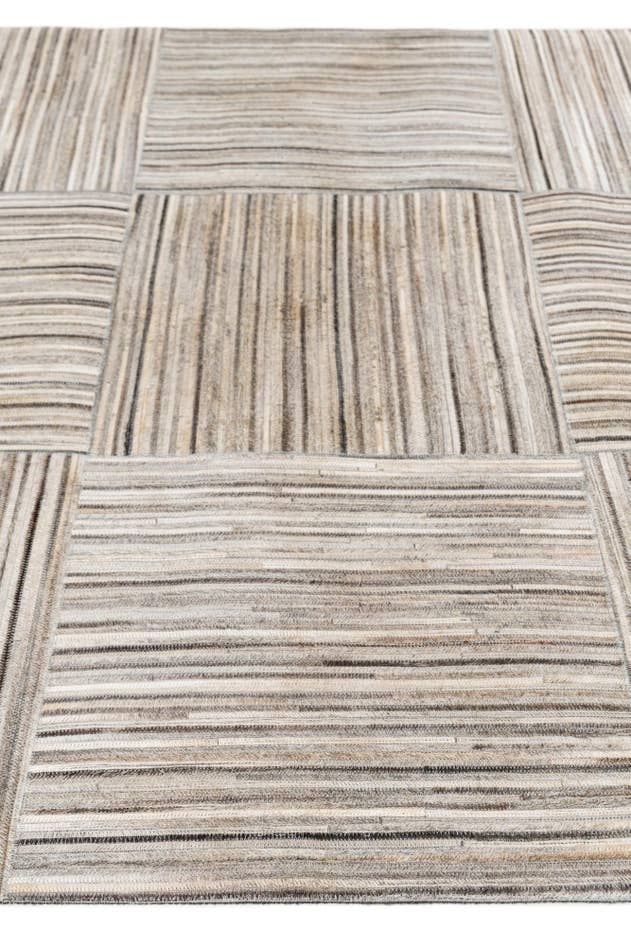 Detail image of 4' 11 x 8' 3 Cowhide Stocks Rug