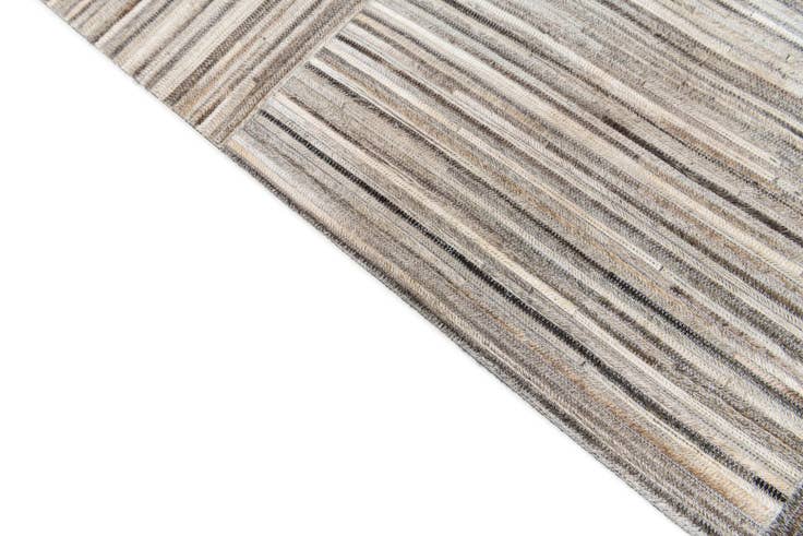Detail image of 4' 11 x 8' 3 Cowhide Stocks Rug