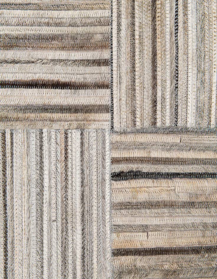 Detail image of 4' 11 x 8' 3 Cowhide Stocks Rug