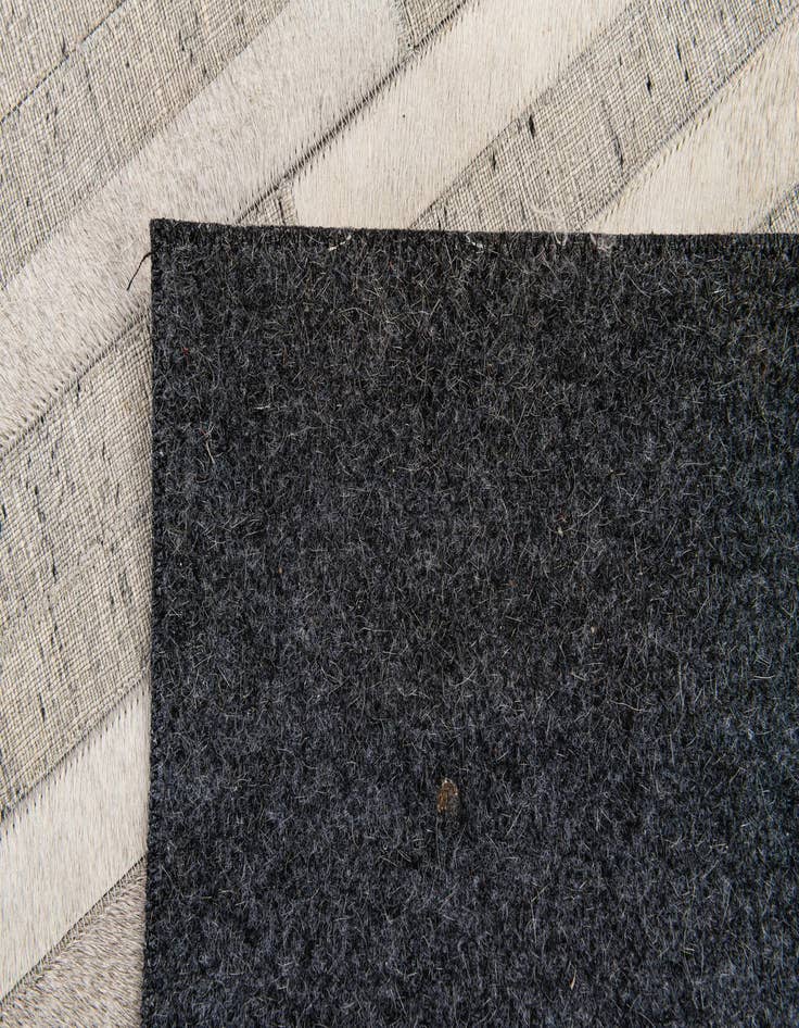 Detail image of 4' 1 x 6' 1 Cowhide Stocks Rug