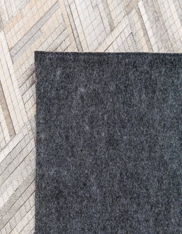 Detail image of 4' 1 x 6' 1 Cowhide Stocks Rug