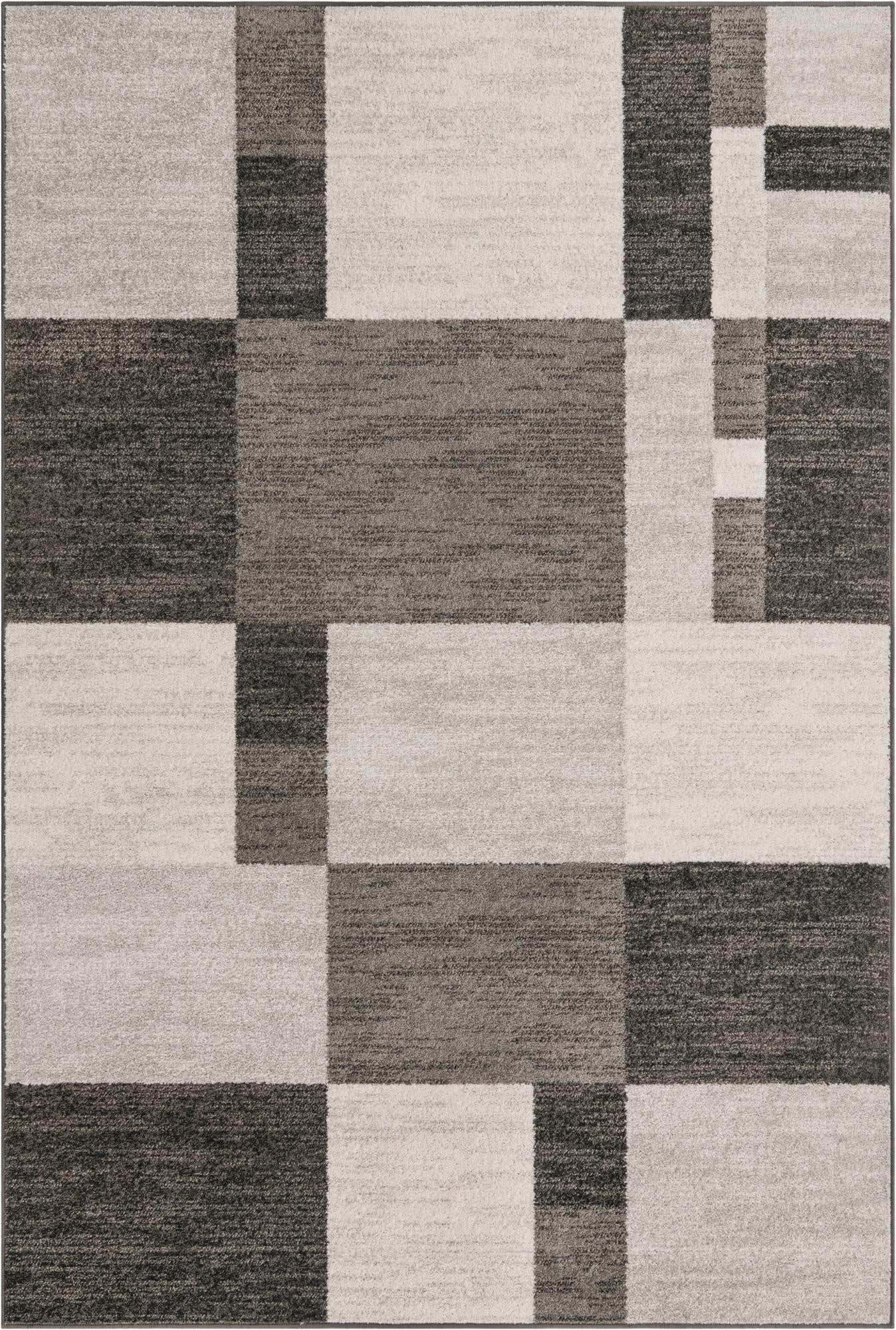 A 6x9 rectangular gray modern area rug featuring a geometric block pattern in varying shades of light and dark gray.