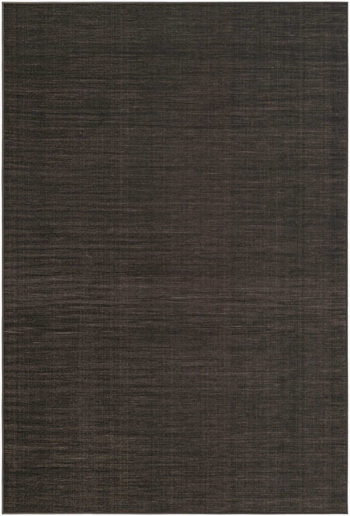 A 6x9 rectangular SoHo Collection rug in a dark gray, almost black, with subtle horizontal striations, showcasing its flat weave and urban style.