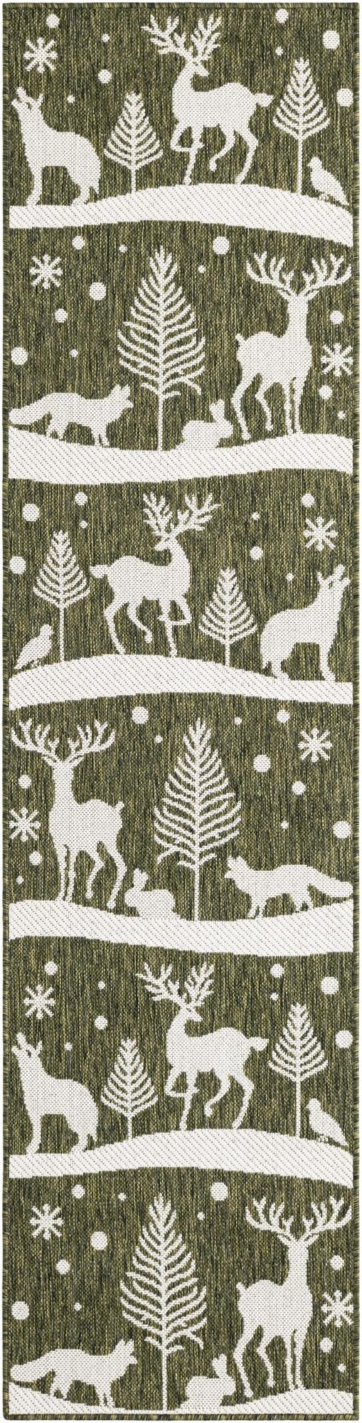 A long green runner rug with a repeating white winter forest scene featuring deer, foxes, rabbits, birds, and pine trees under falling snow and snowflakes.