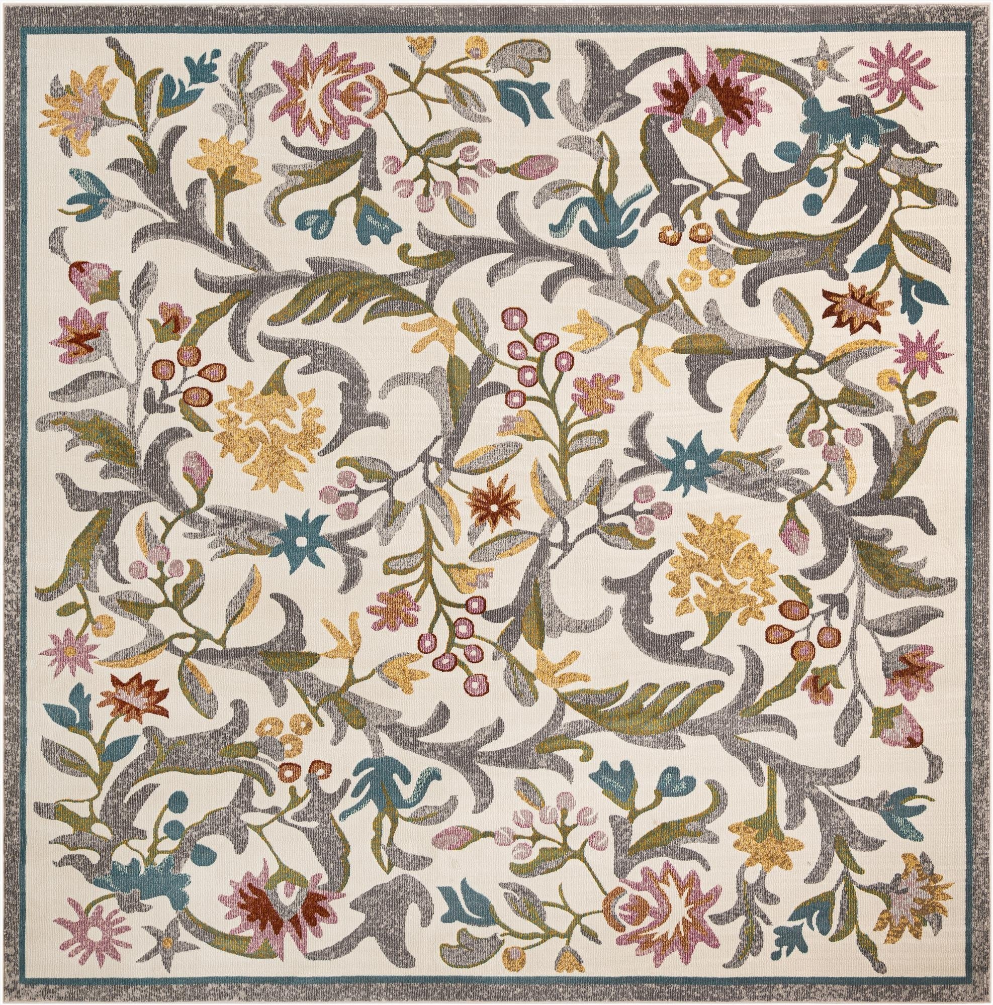 Square ivory rug with a vibrant floral and botanical pattern featuring pink, yellow, blue, and green accents, ideal for a patio.