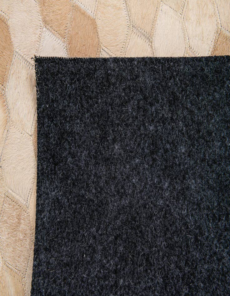 Detail image of 3' 11 x 6' Cowhide Stocks Rug