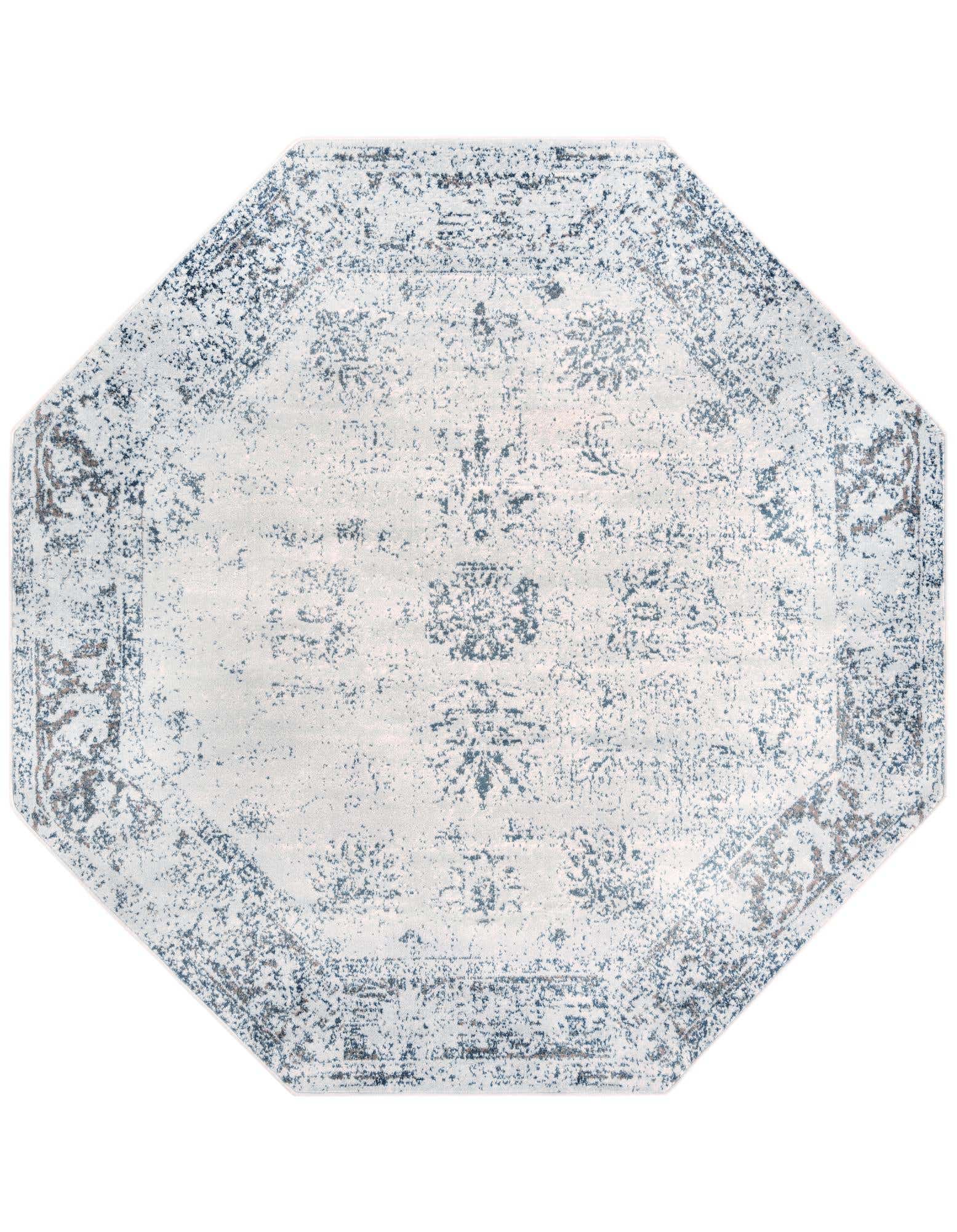 An octagon-shaped light blue and white distressed traditional area rug with a medallion pattern.