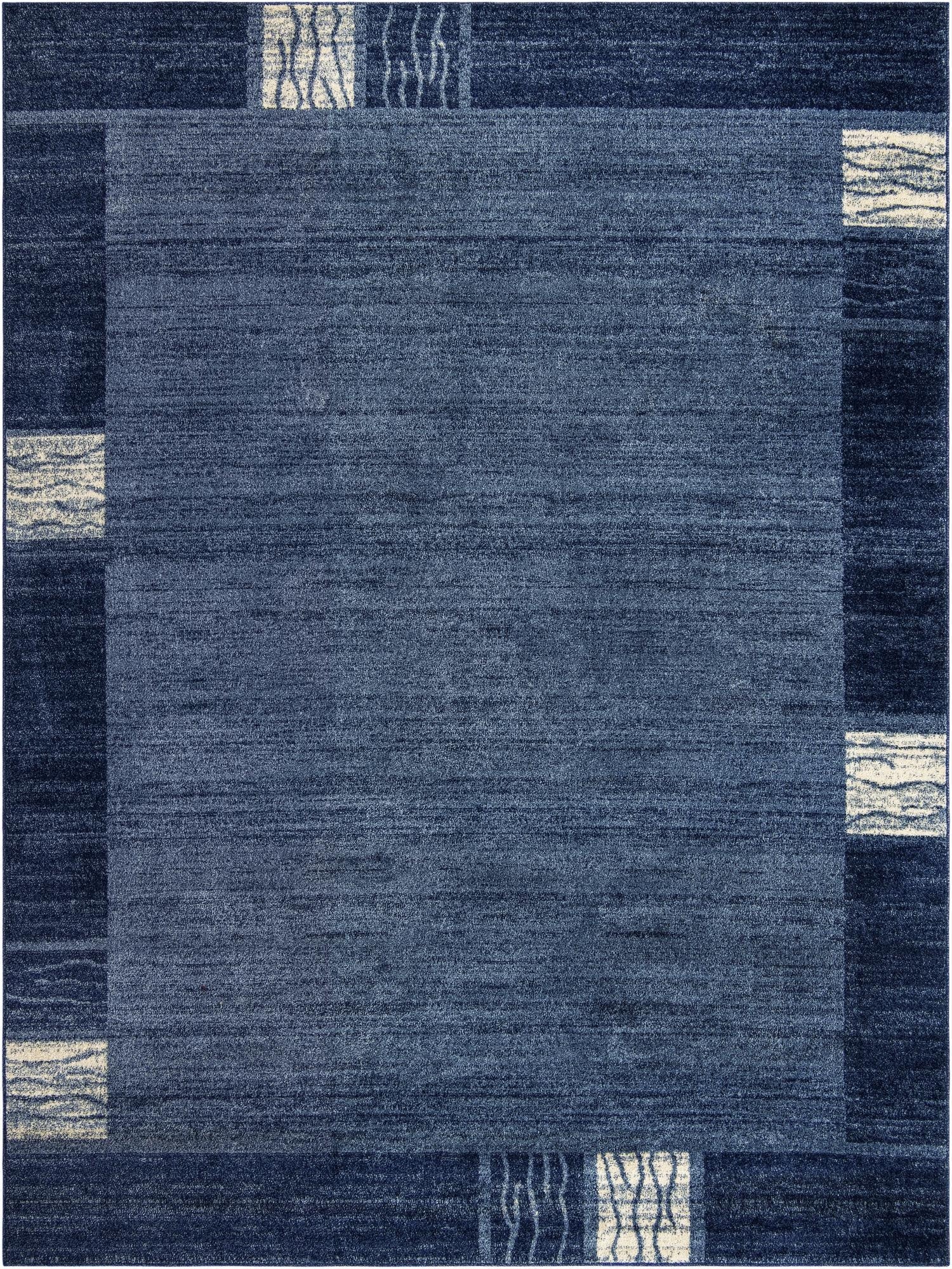 A 9x12 rectangular Rugs.com Angelica rug featuring a contemporary blue design with lighter blue and cream abstract patterns.