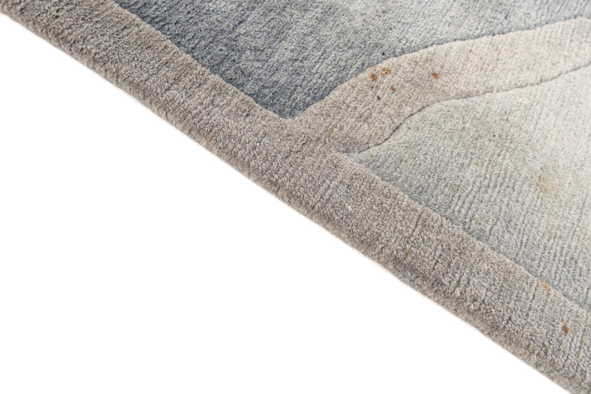 6' 7 x 9' 3 Hand Knotted Tibet Wool Rug