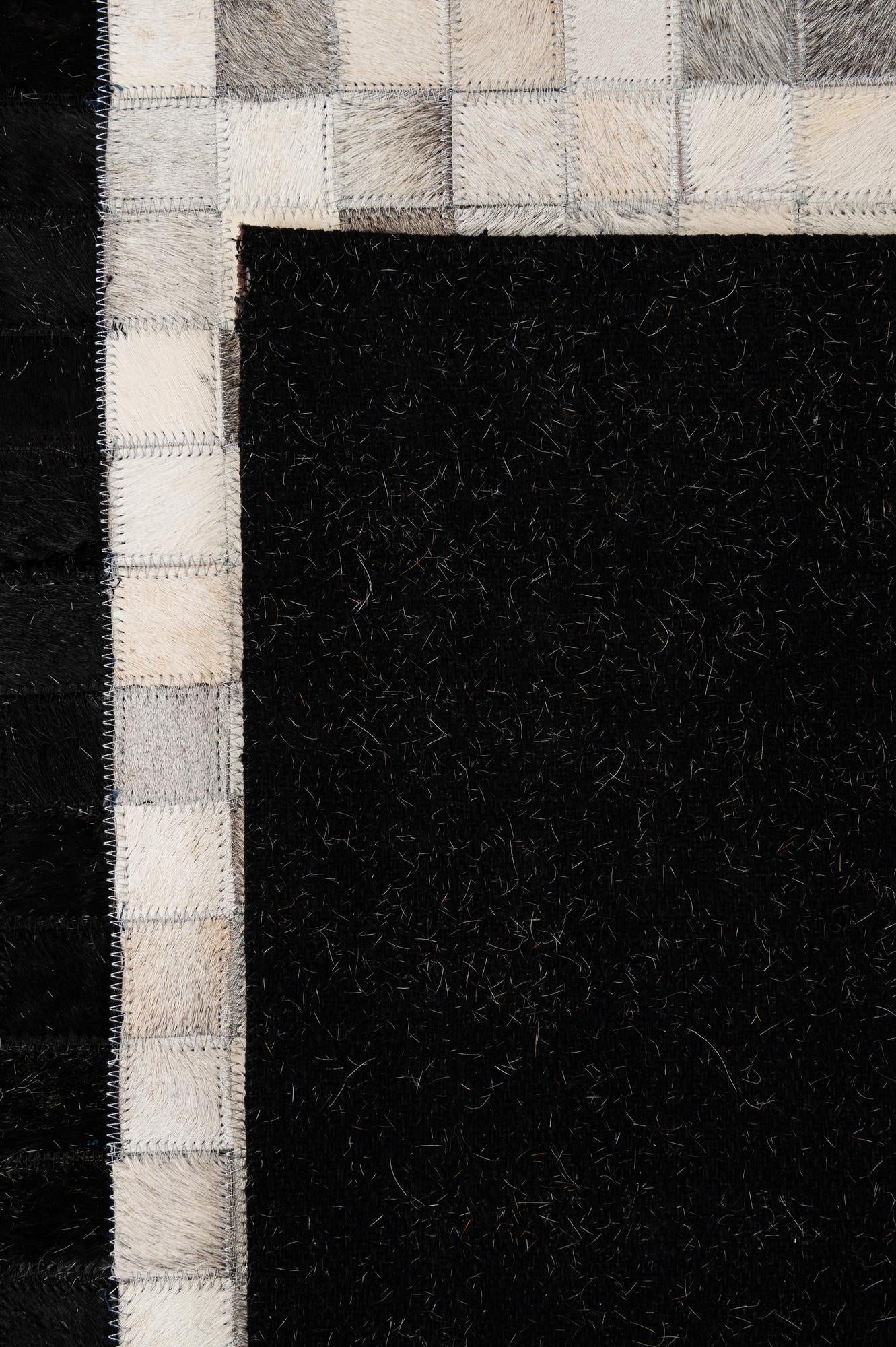 4' 11 x 7' 10 Cowhide - Patchwork Rug