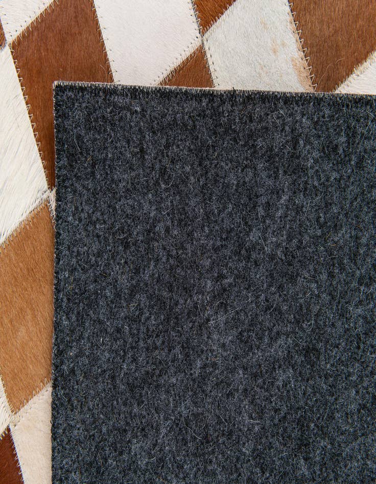 Detail image of 5' x 7' 11 Cowhide Stocks Rug