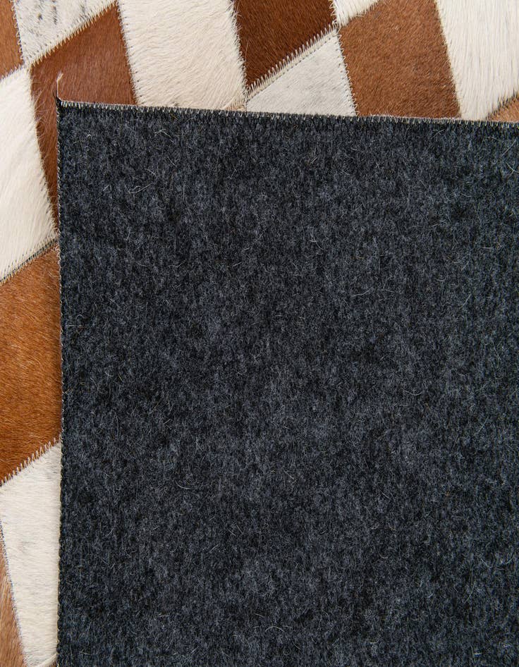 Detail image of 5' x 7' 11 Cowhide Stocks Rug
