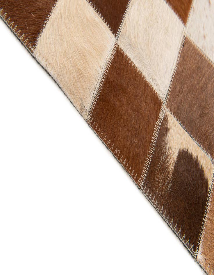 Detail image of 5' x 7' 11 Cowhide Stocks Rug