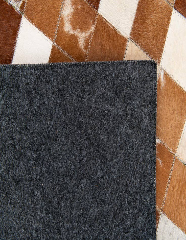 Detail image of 5' x 7' 11 Cowhide Stocks Rug