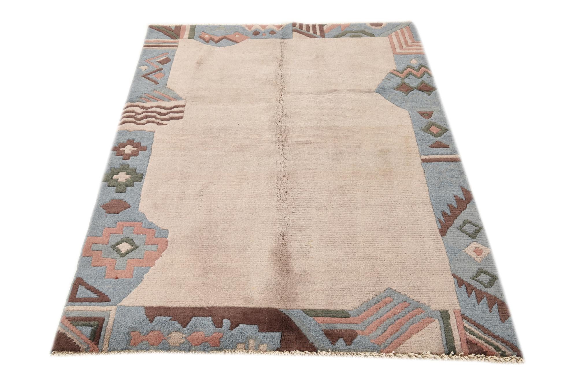 3' 11 x 5' 10 Hand Knotted Nepal Wool Rug