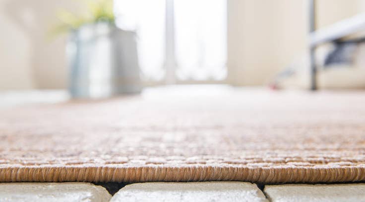 Detail image of 5' 3 x 8' Easy-Clean Border Indoor / Outdoor Rug
