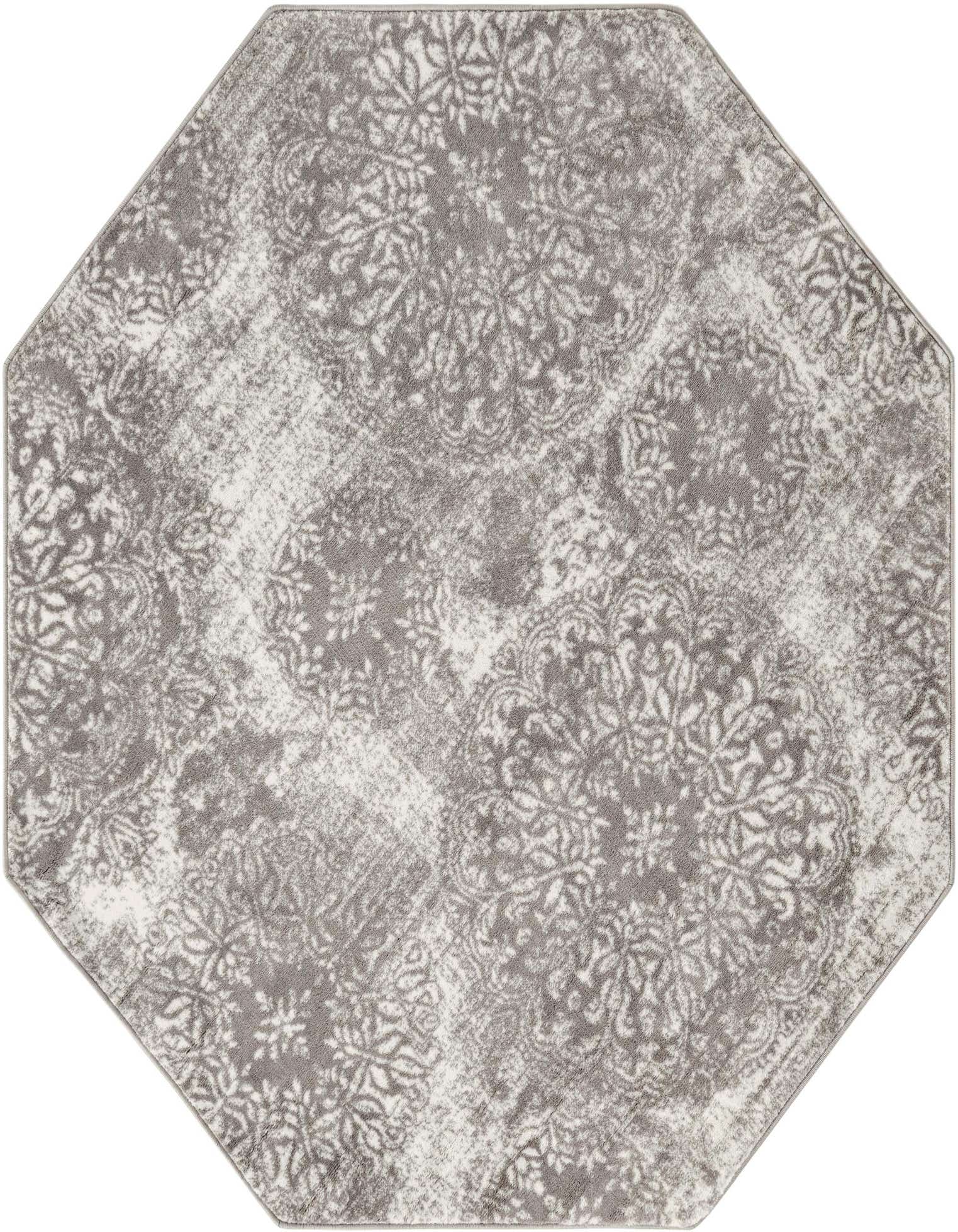 An octagon-shaped gray and white transitional rug with a distressed floral medallion pattern.