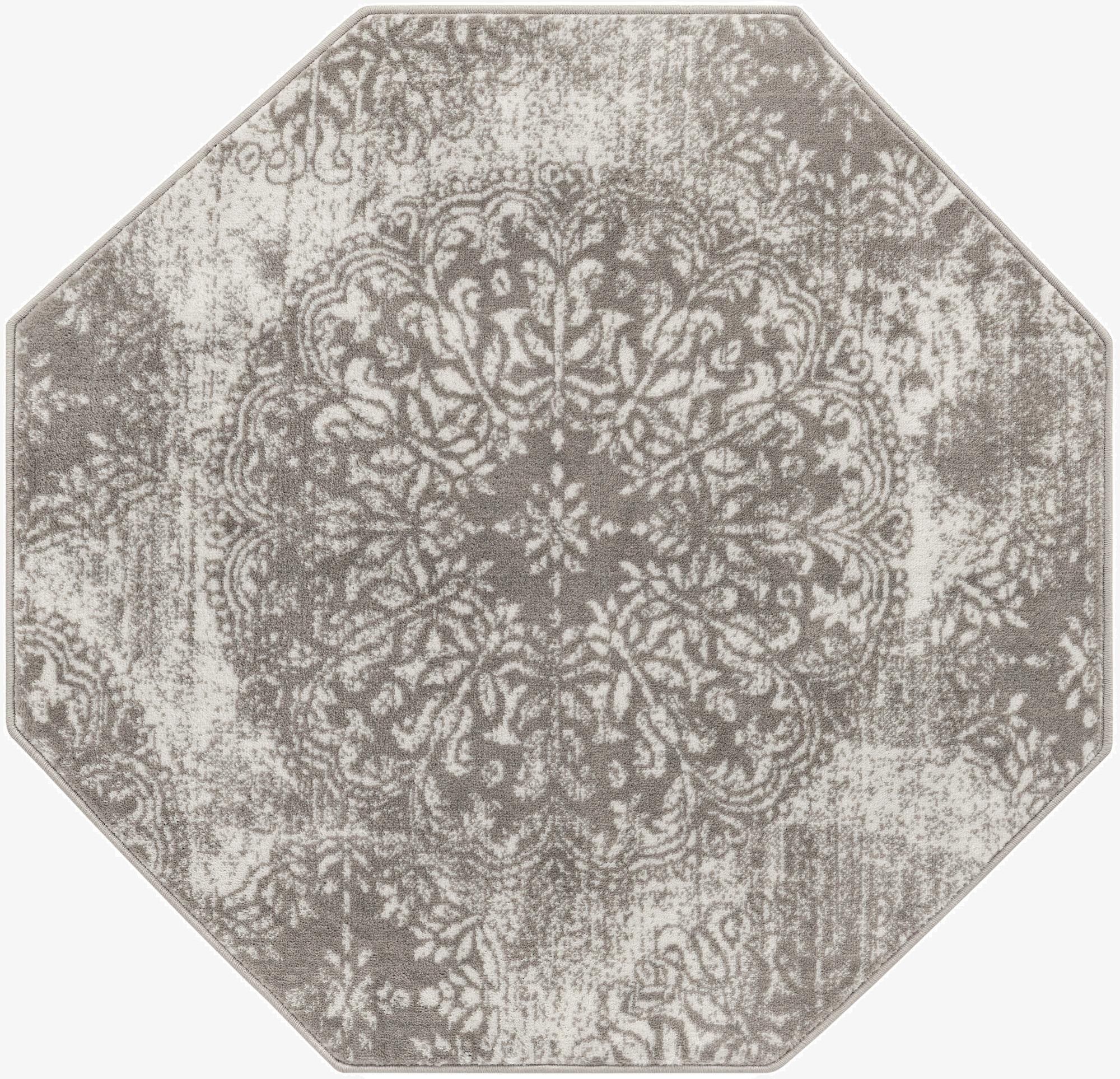 Octagon-shaped gray and silver transitional rug with a distressed floral medallion pattern, suitable for various indoor spaces.