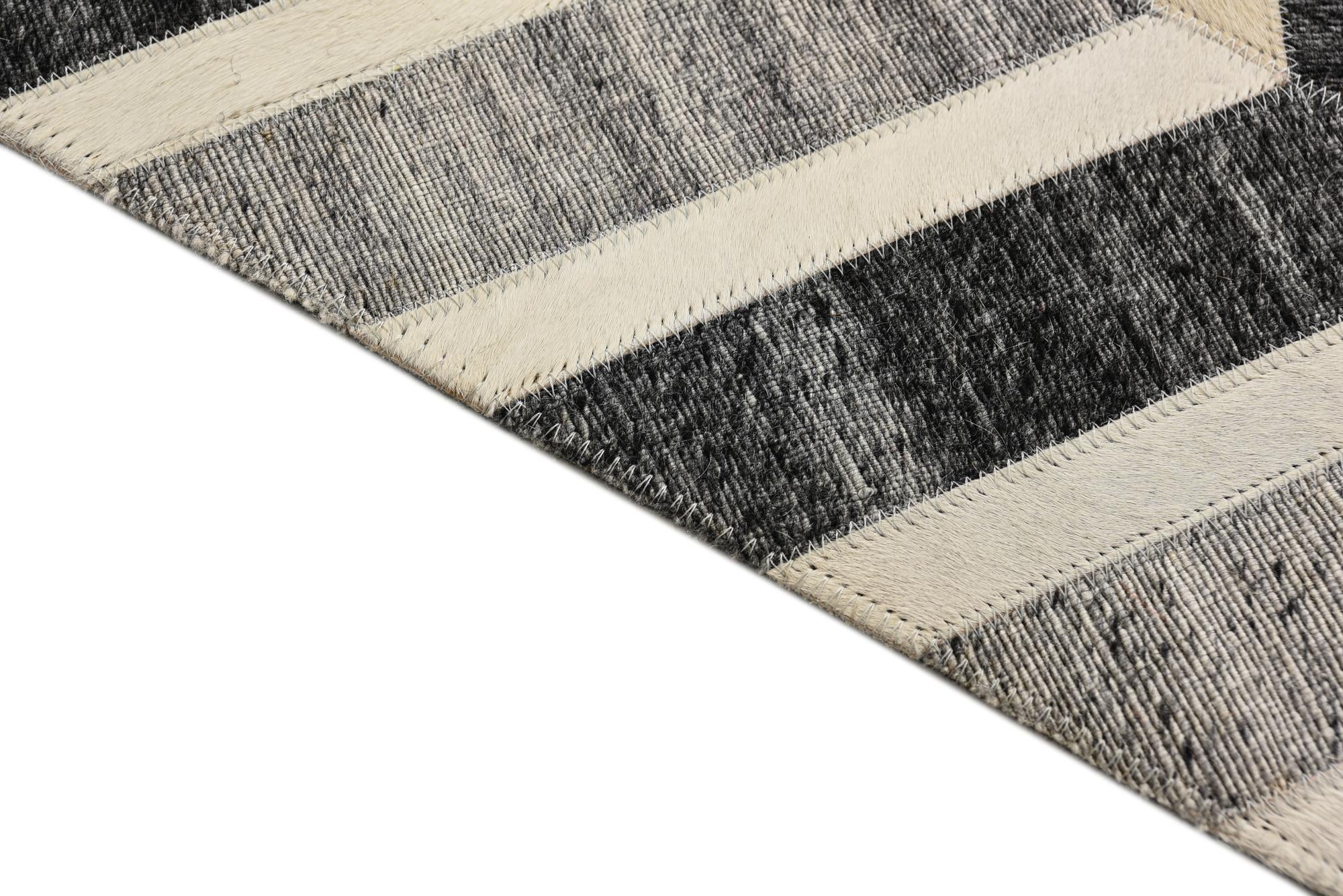 5' 2 x 7' 10 Cowhide Rug