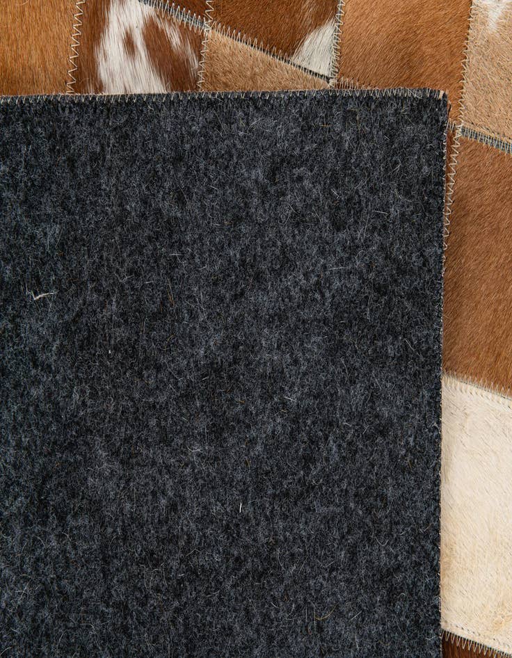 Detail image of 5' x 7' 11 Cowhide Stocks Rug