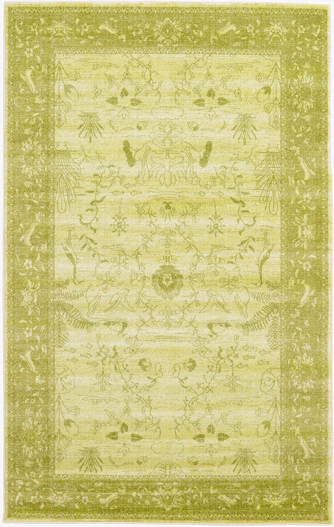 A 5x8 rectangular indoor area rug in varying shades of green, featuring a traditional botanical pattern with a distinct border.