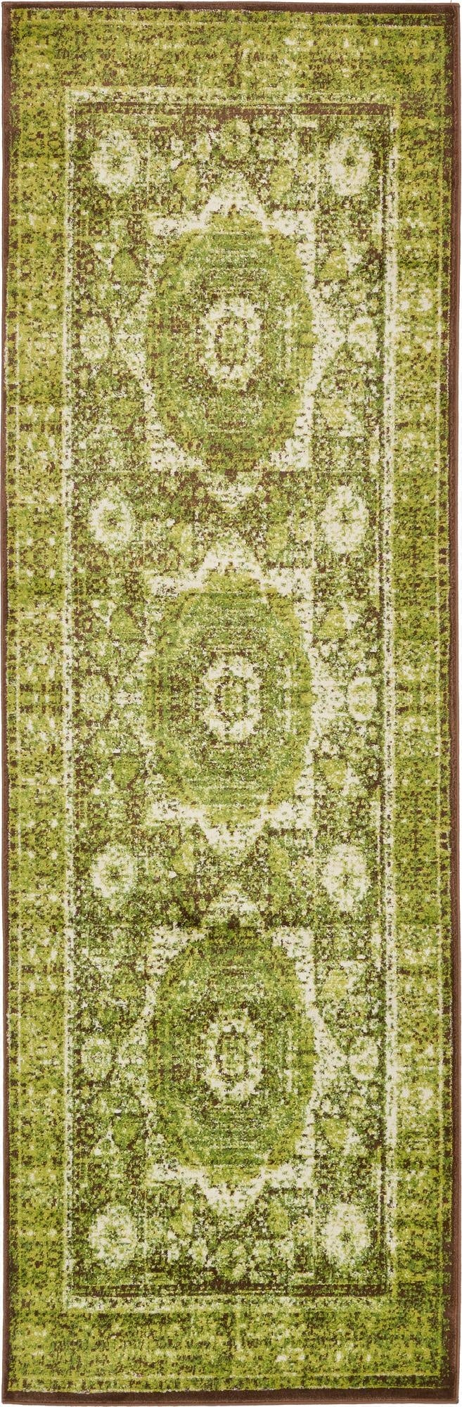 A 10 ft runner rug in shades of green and brown, featuring a distressed medallion pattern, ideal for a hallway.
