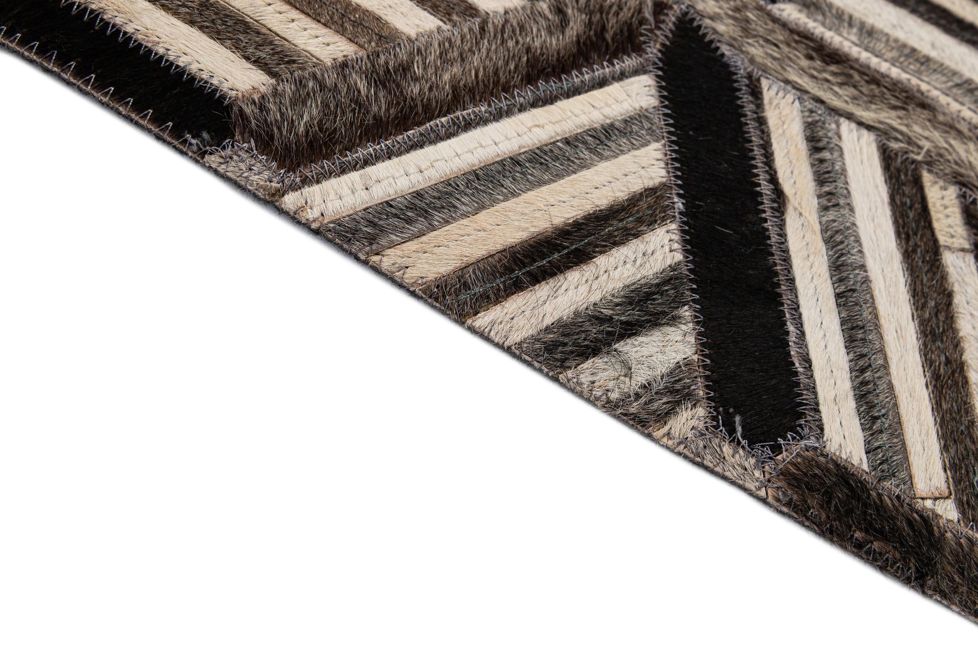 4' 11 x 7' 10 Cowhide - Patchwork Rug