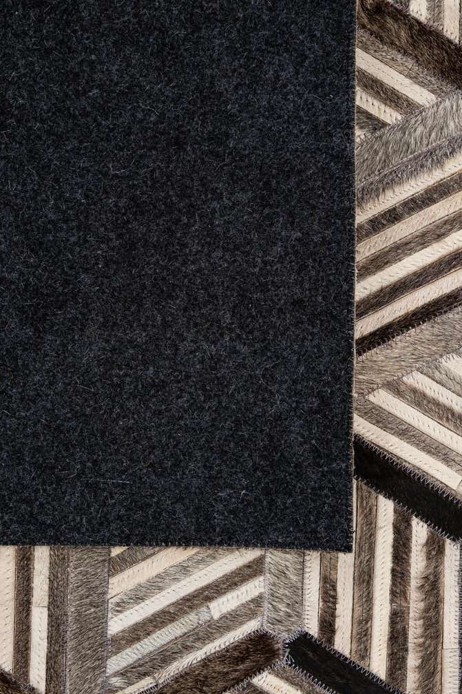 4' 11 x 7' 10 Cowhide - Patchwork Rug