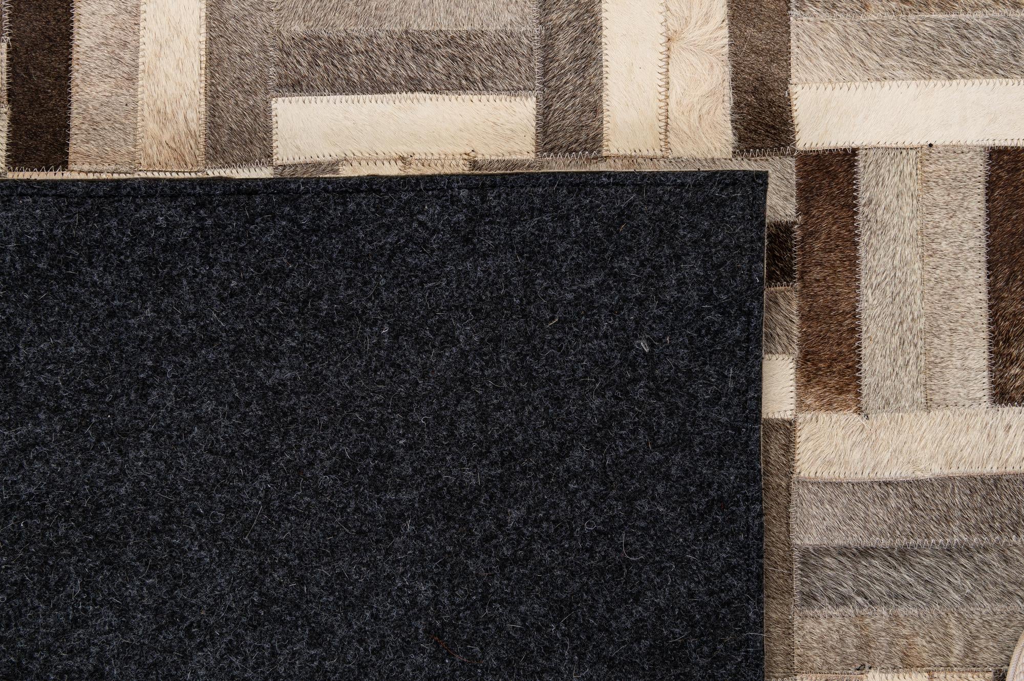 5' 5 x 8' 2 Cowhide - Patchwork Rug