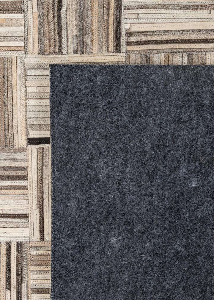 4' 11 x 7' 10 Cowhide - Patchwork Rug