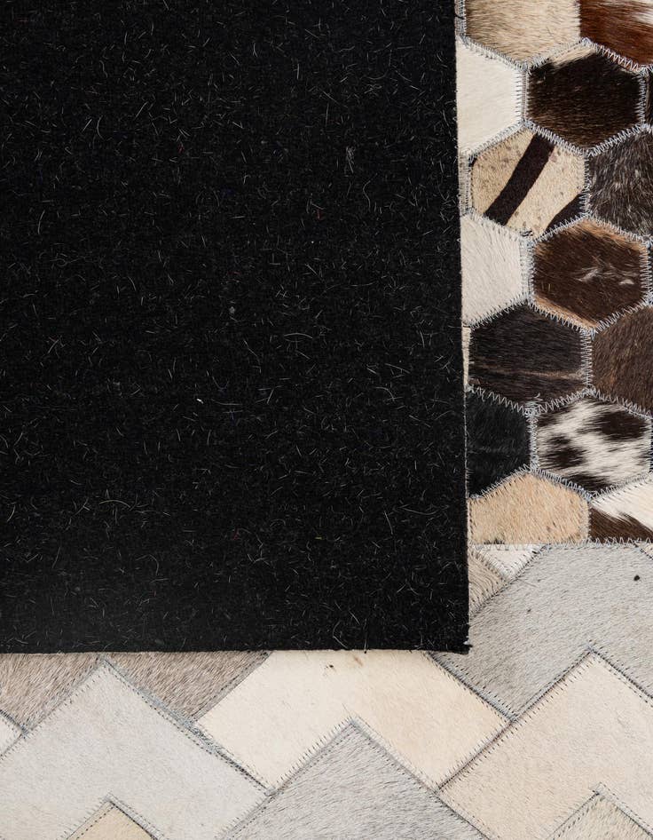 Detail image of 4' 11 x 8' 1 Cowhide - Patchwork Rug